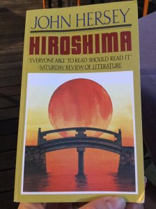 Book cover, large sun rising behind a Japanese style bridge. John Hersey, Hiroshima.